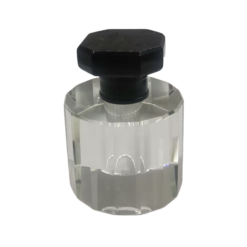 How does the density and texture of a zinc perfume cap enhance the ritual of opening a bottle?
